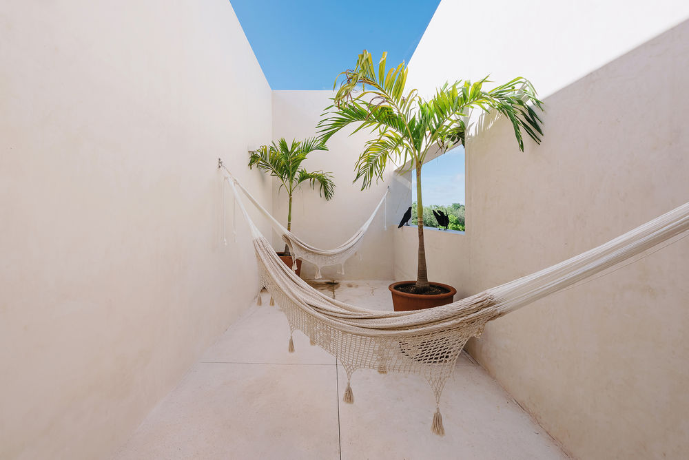 墨西哥 Yucatán 别墅 Kutz House——室内外和谐共生，打造实用低维护度假之家